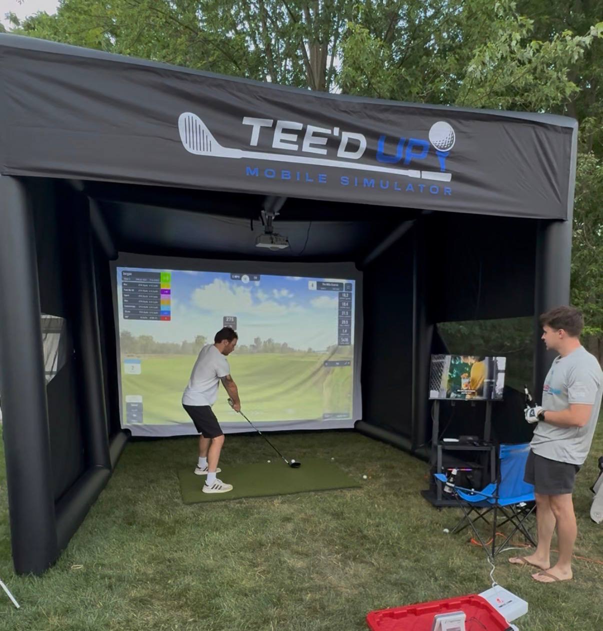 Full Tee’d Up inflatable golf simulator setup at an outdoor event